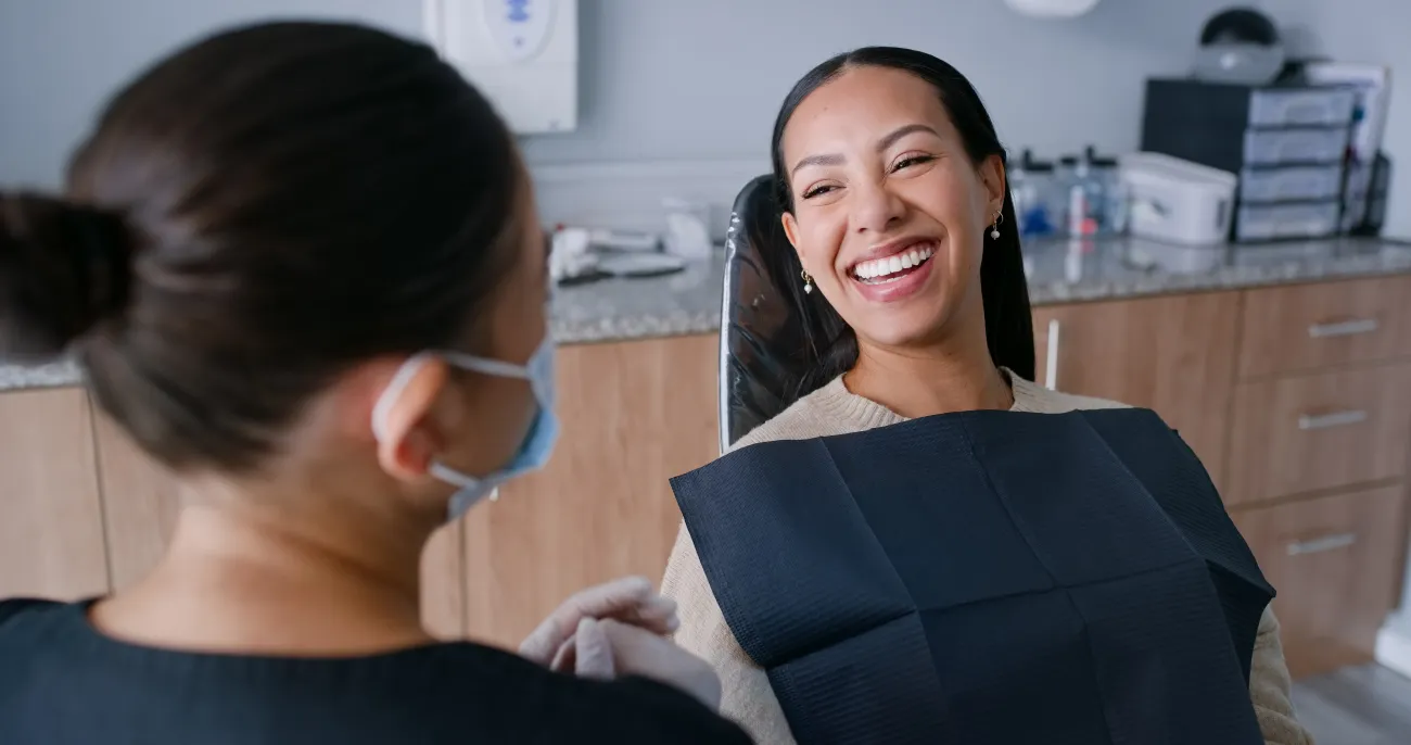 Clinician treating a smiling patient